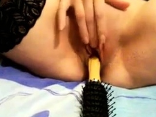 Hot Babe dildoing her pussy with hairbrush